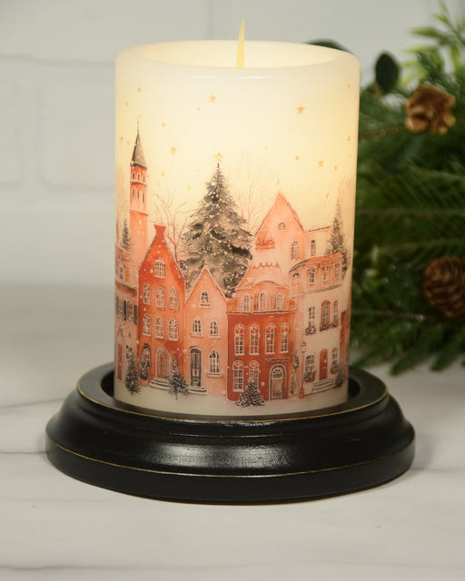 Winter Christmas Village candle sleeve displayed on a black LastingLite electric candle base.